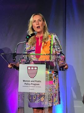 Iris Bohnet speaking at a podium